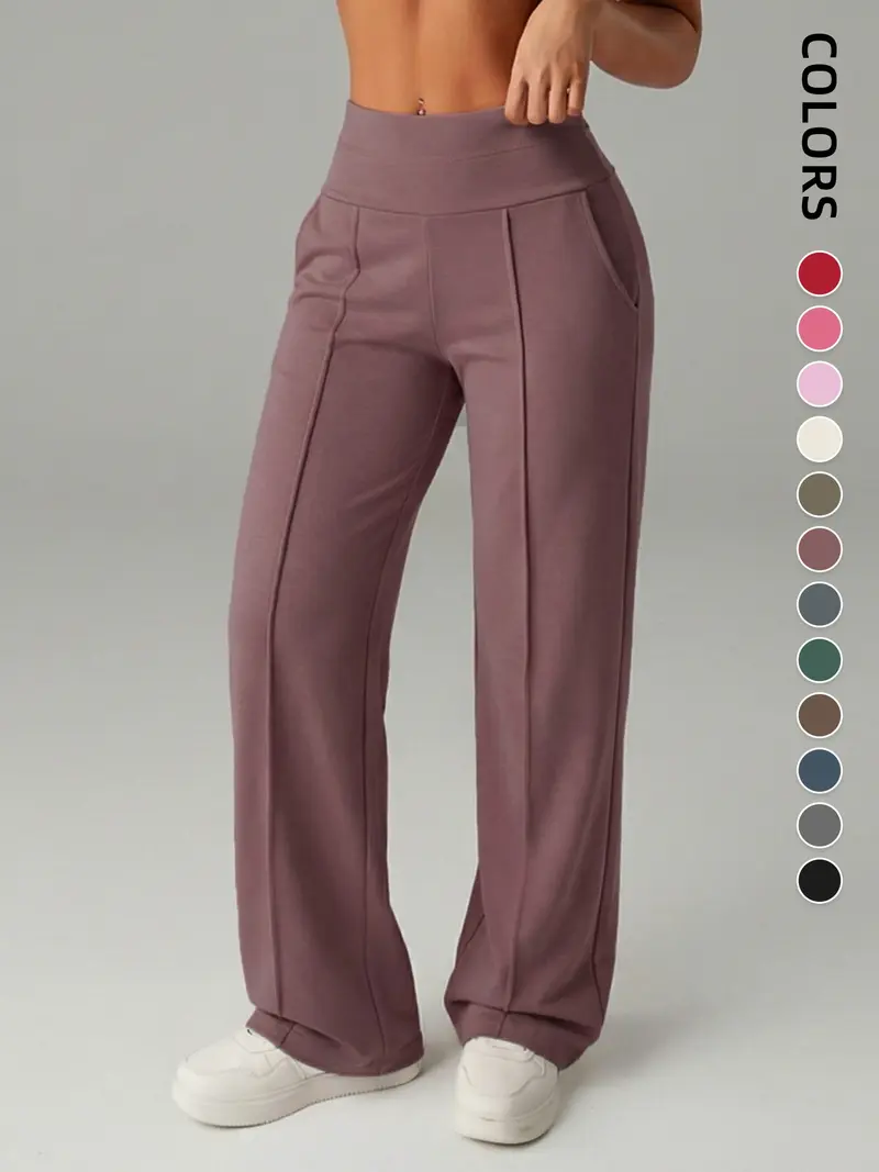 Pantalones de mujer de tiro medio, cintura elástica y pernera ancha; estilo deportivo casual, cómodos bolsillos laterales; prenda versátil para primavera y otoño; ideales para el día a día; moda femenina.